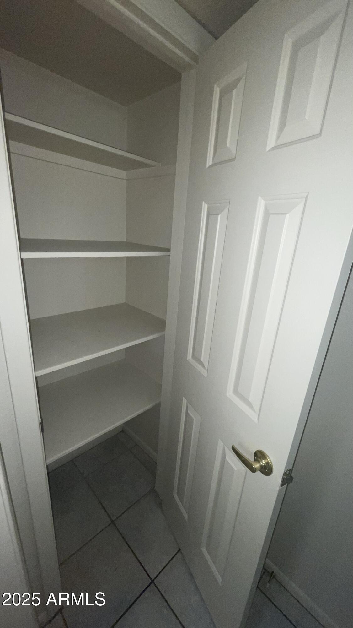17811 North 29th Drive Phoenix, AZ 85053 - Photo 14 of 14 a view of walk in closet with empty racks