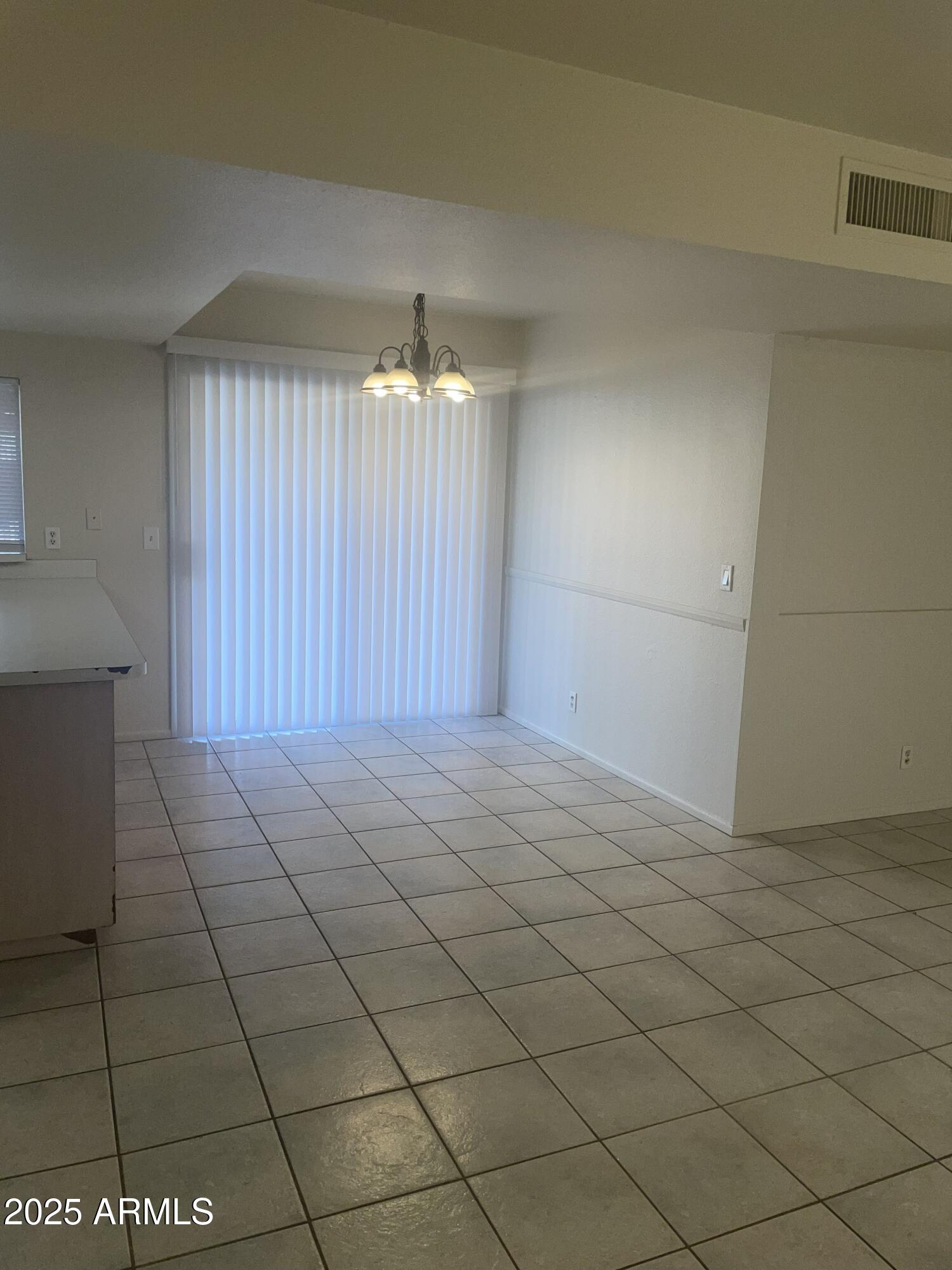17811 North 29th Drive Phoenix, AZ 85053 - Photo 4 of 14 an empty room with windows