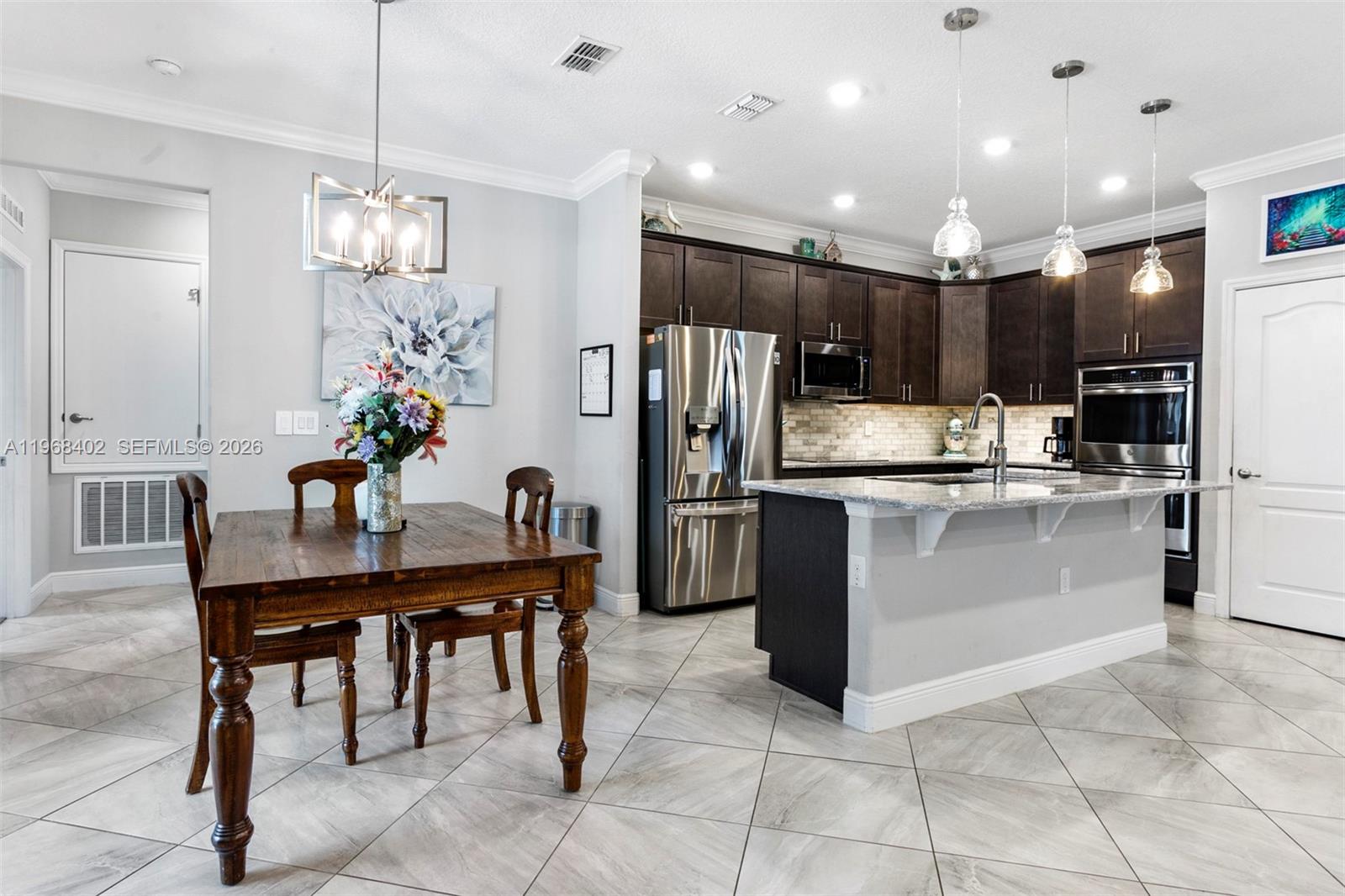 1773 Southwest Palermo Road Port St. Lucie, FL 34987 - Photo 15 of 50 Breakfast nook overlooking pool/patio!