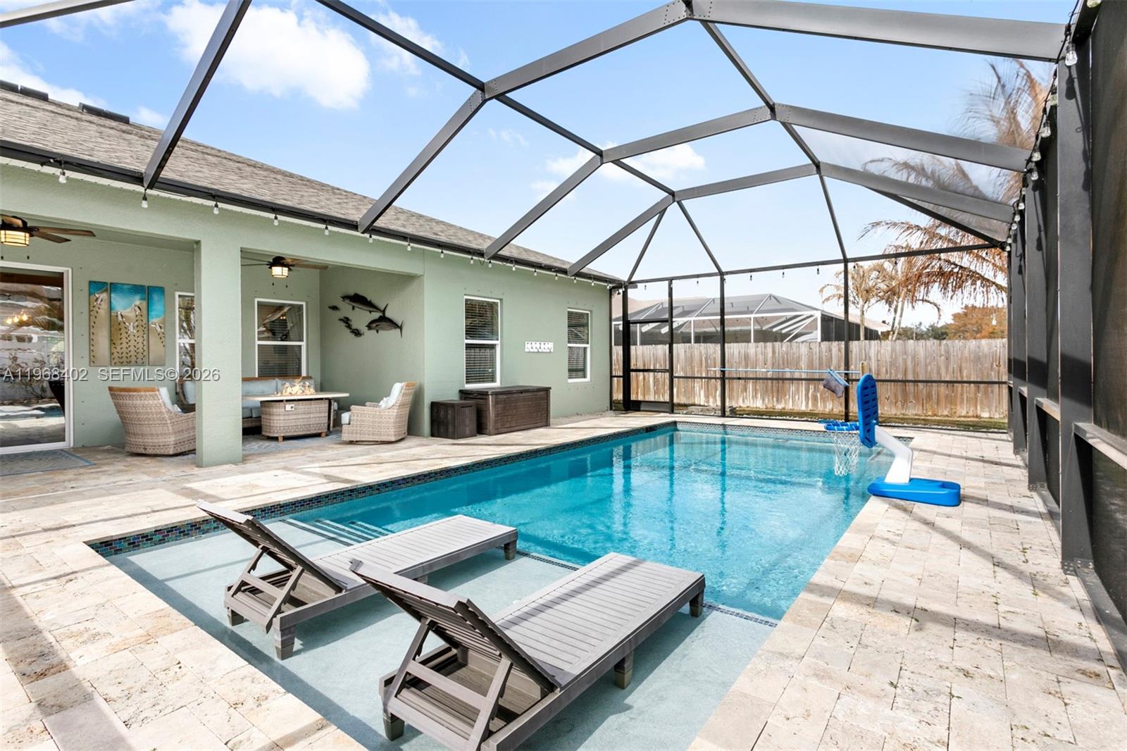 1773 Southwest Palermo Road Port St. Lucie, FL 34987 - Photo 2 of 50 Amazing screened pool/patio area - heated pool, covered patio, florida living at its best!!
