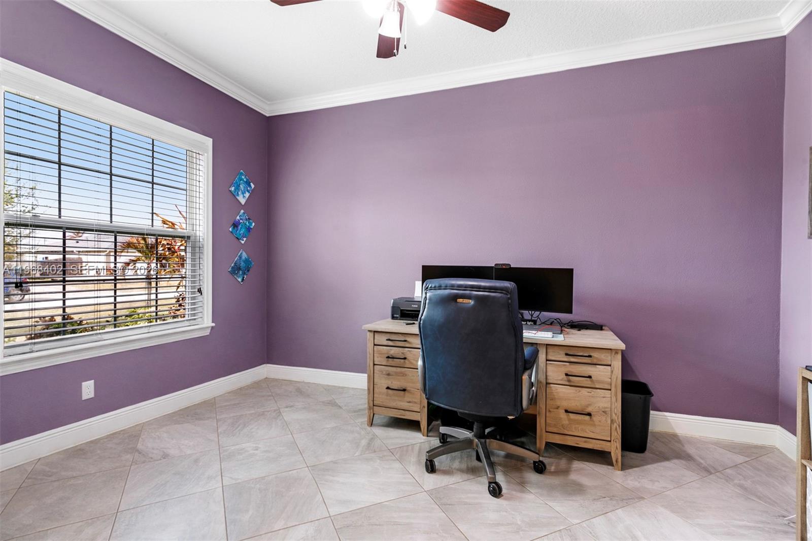 1773 Southwest Palermo Road Port St. Lucie, FL 34987 - Photo 27 of 50 Office/Den features picture window, large tile flooring, volume ceiling, crown molding,unique barn sliding doors, ceiling fan.