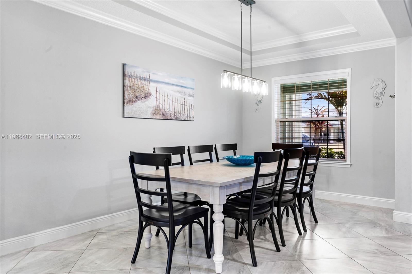 1773 Southwest Palermo Road Port St. Lucie, FL 34987 - Photo 29 of 50 Large beautiful formal dining room - trey ceilings with crown molding, picture window!