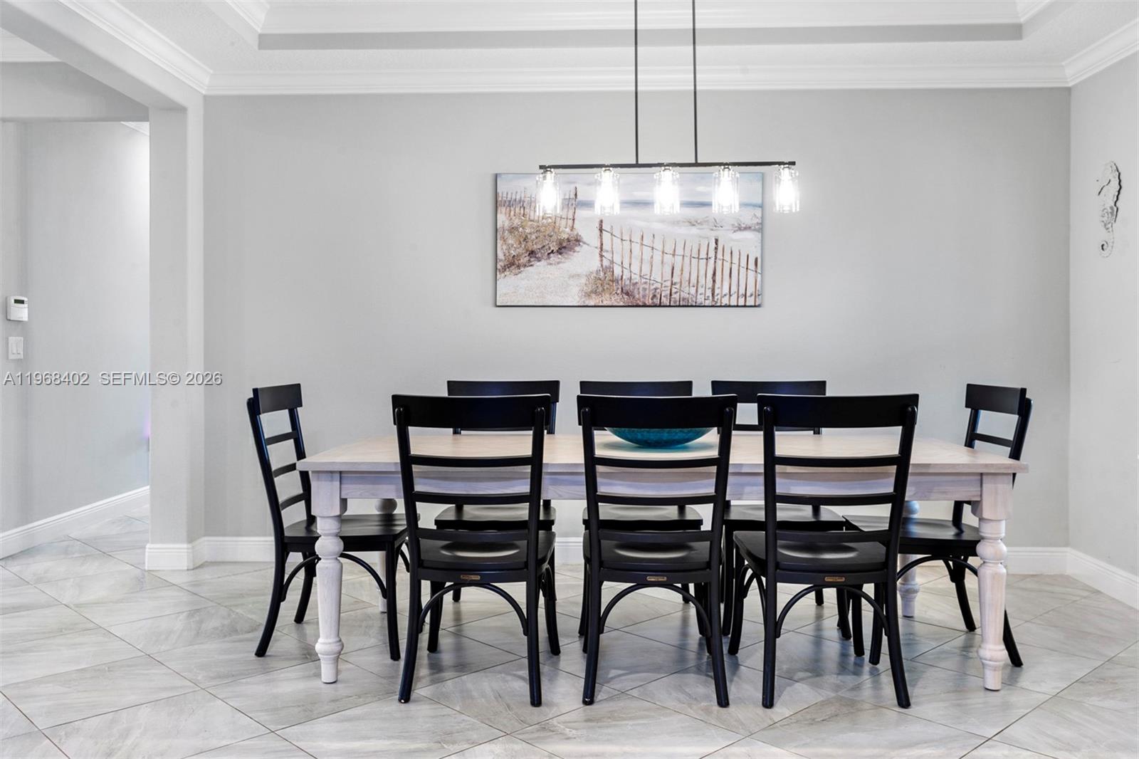 1773 Southwest Palermo Road Port St. Lucie, FL 34987 - Photo 30 of 50 Large beautiful formal dining room - trey ceilings with crown molding and picture window!