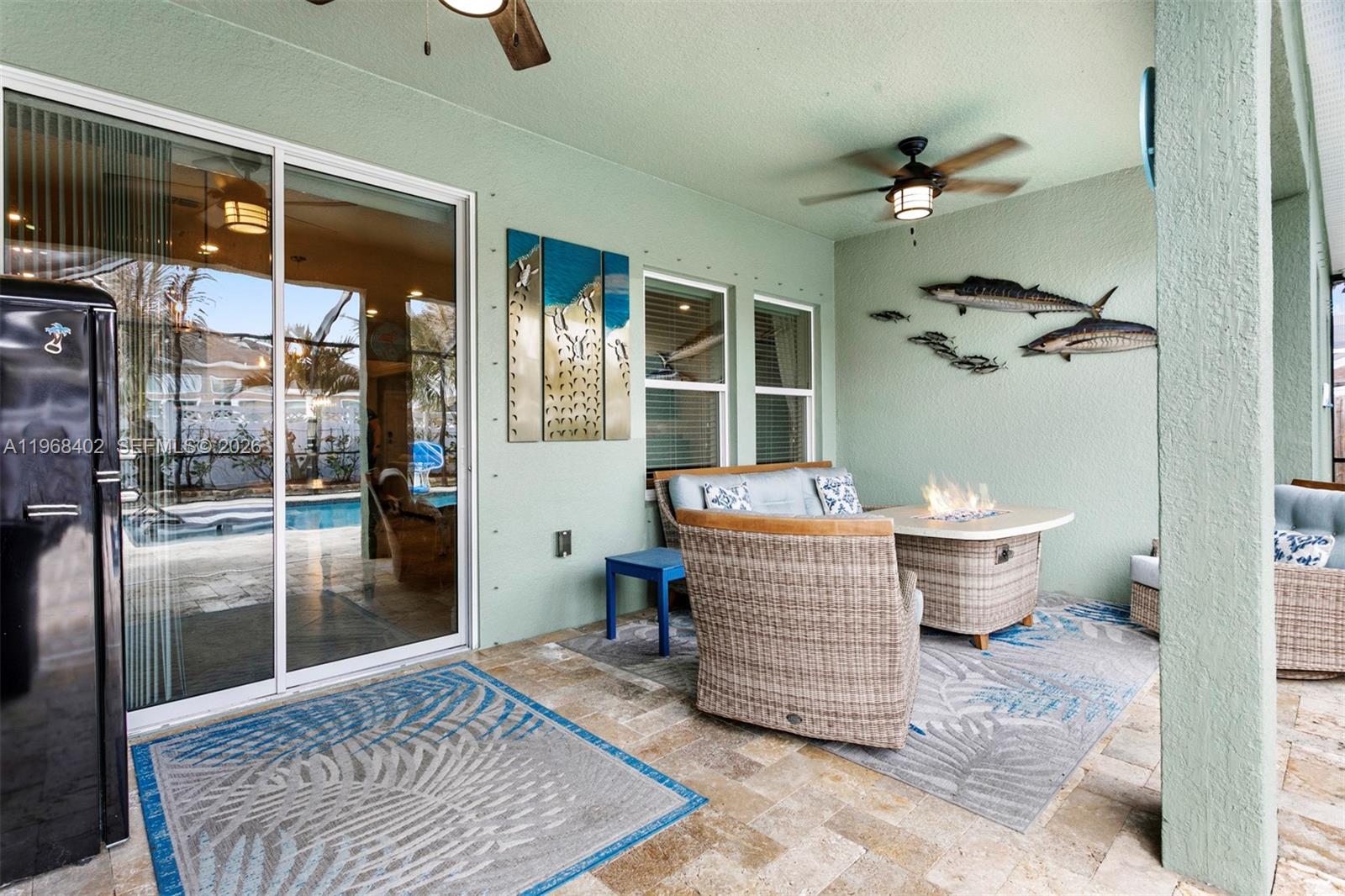 1773 Southwest Palermo Road Port St. Lucie, FL 34987 - Photo 32 of 50 Spacious covered back patio overlooking the sparkling pool - relax and enjoy!!