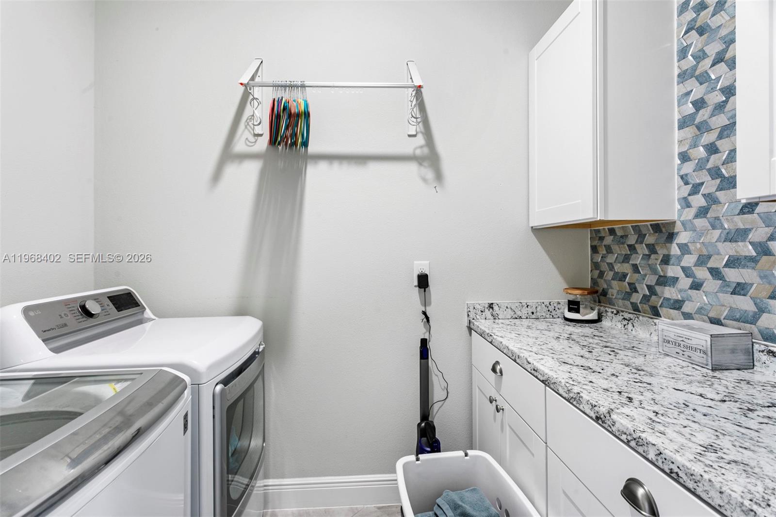 1773 Southwest Palermo Road Port St. Lucie, FL 34987 - Photo 36 of 50 Room to fold laundry and store laundry supplies!