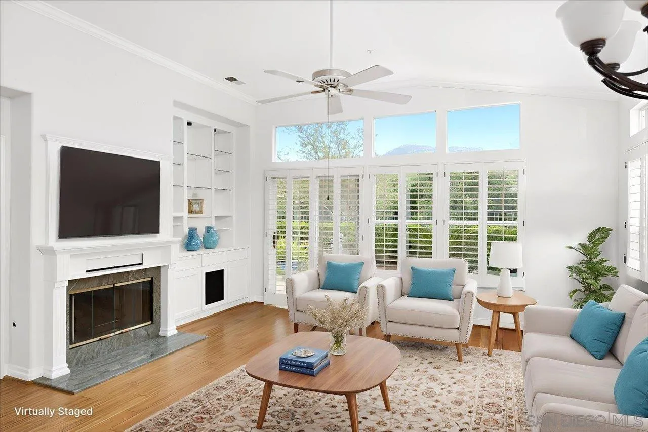 2314 Fallbrook Place Escondido, CA 92027 - Photo 15 of 30 a living room with furniture a fireplace and a flat screen tv