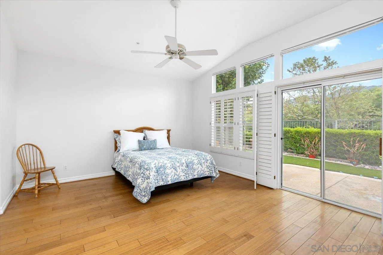 2314 Fallbrook Place Escondido, CA 92027 - Photo 18 of 30 a bedroom with a bed and a chair