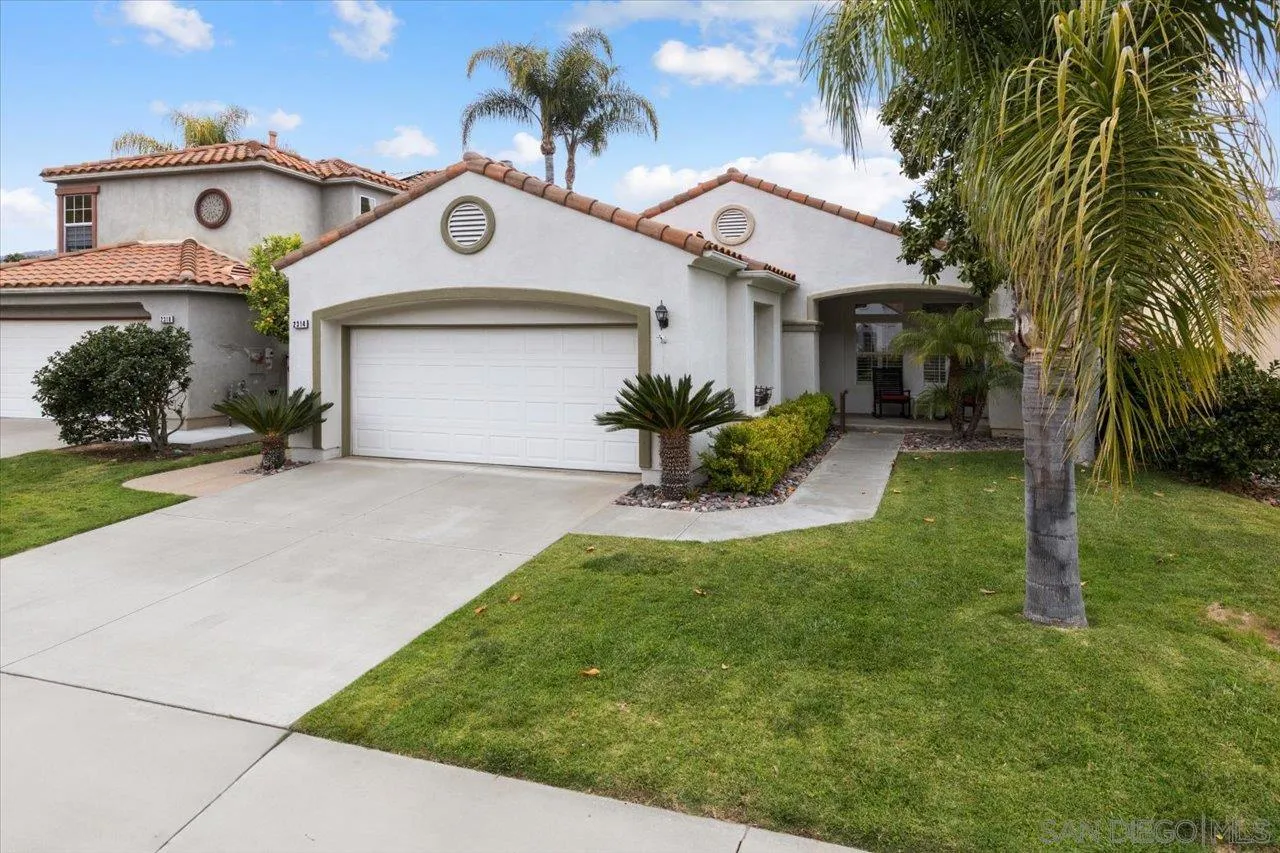 2314 Fallbrook Place Escondido, CA 92027 - Photo 2 of 30 a front view of a house with a yard and potted plants