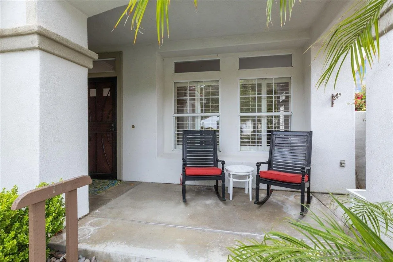 2314 Fallbrook Place Escondido, CA 92027 - Photo 3 of 30 a balcony with two couches and painted walls