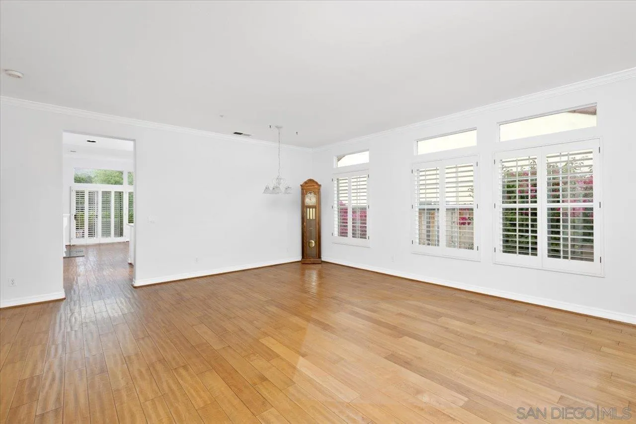 2314 Fallbrook Place Escondido, CA 92027 - Photo 4 of 30 a view of an empty room with glass window and hardwood floor