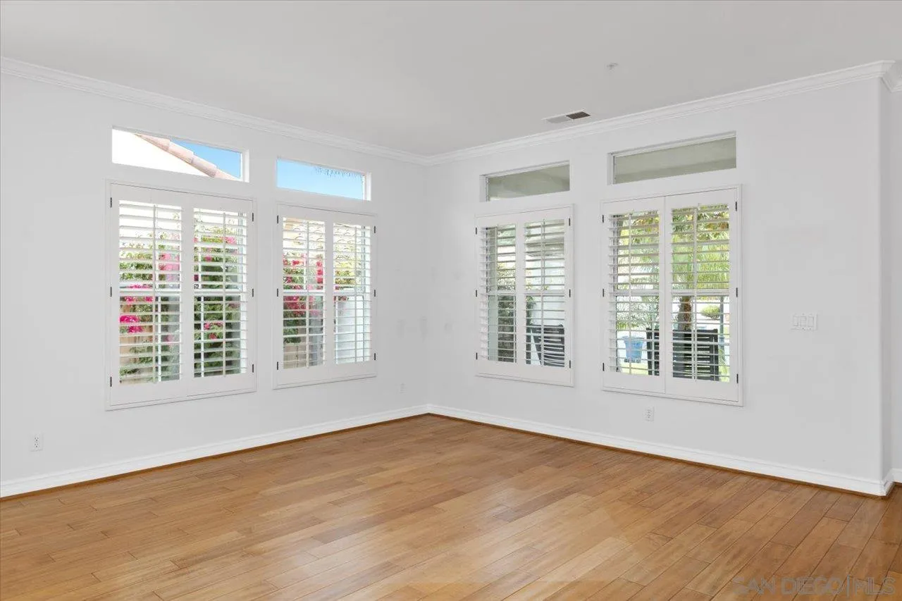 2314 Fallbrook Place Escondido, CA 92027 - Photo 5 of 30 a view of an empty room with wooden floor and a window