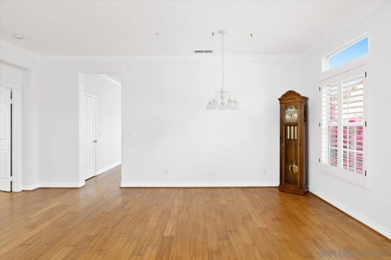 2314 Fallbrook Place Escondido, CA 92027 - Photo 8 of 30 a view of an empty room with window and wooden floor