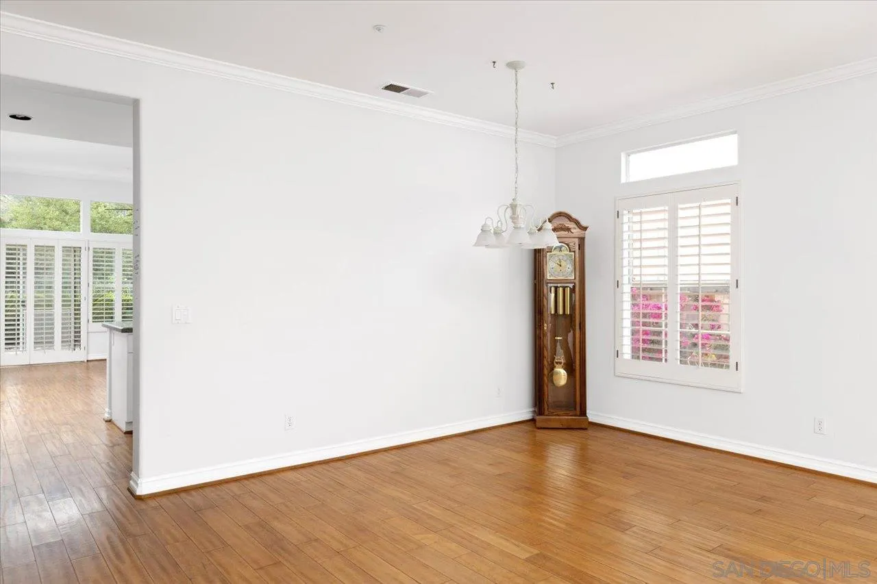 2314 Fallbrook Place Escondido, CA 92027 - Photo 9 of 30 a view of an empty room with wooden floor and a window