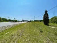 a view of a field with an ocean