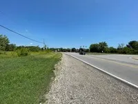 a view of a lake with green space