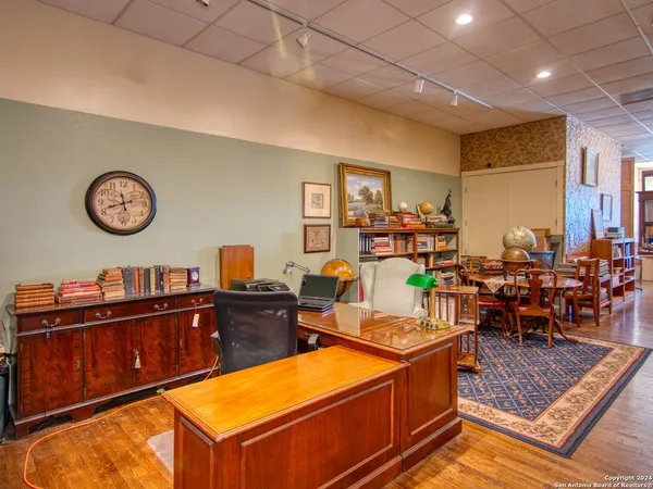 a view of front door with workspace and windows