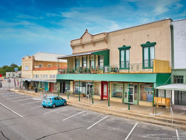 a view of a building with sitting area