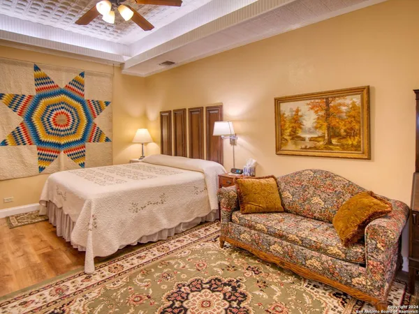 a bedroom with a bed and lamp