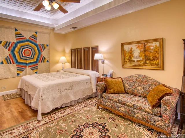 a bedroom with a bed and lamp