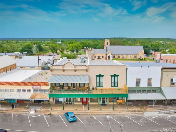 a view of building with an outdoor space and seating area