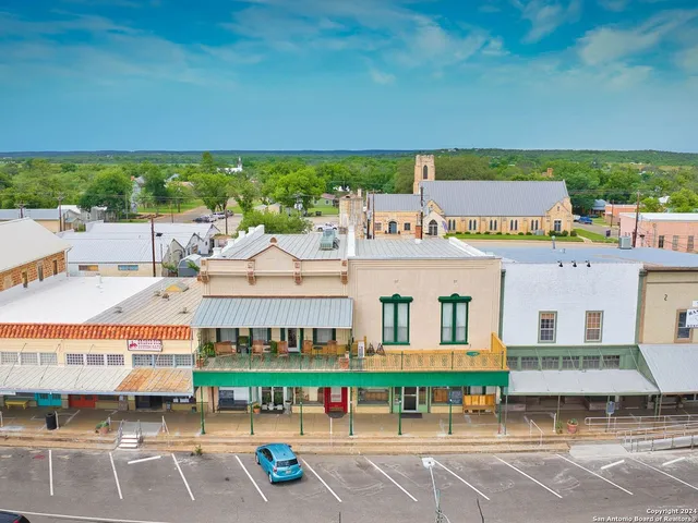 a view of building with an outdoor space and seating area