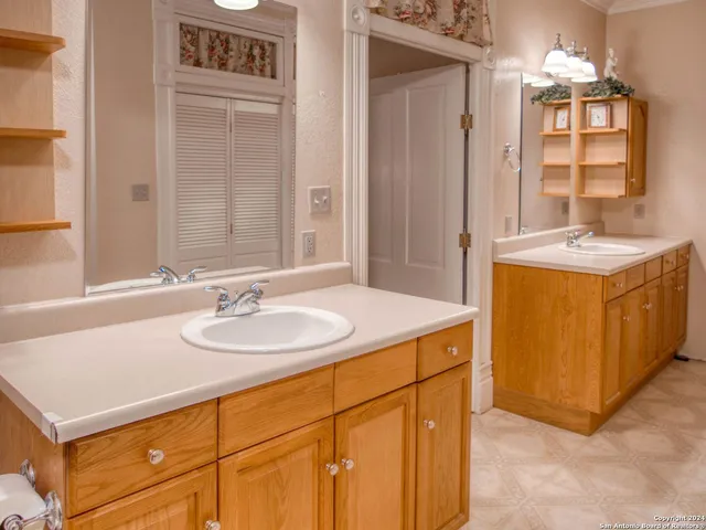 a bathroom with a shower curtain and a sink