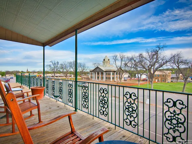 a view of a brick building with a lots of windows