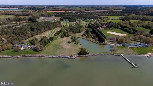 an aerial view of a residential houses with outdoor space