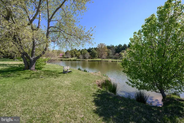a view of a lake with a house in the background