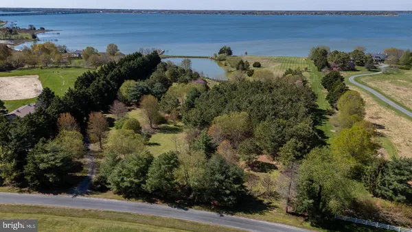 an aerial view of multiple house with a yard