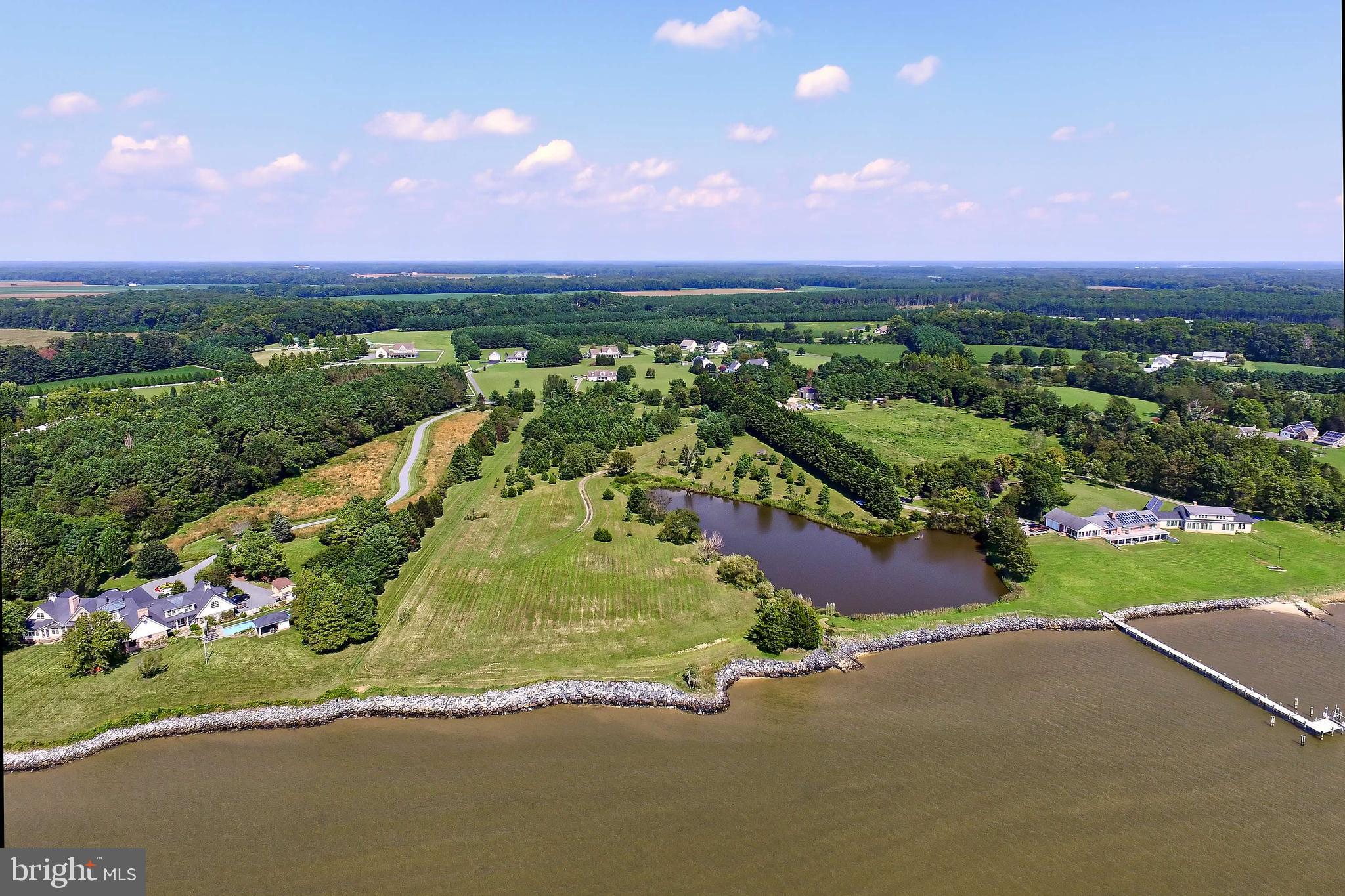 29569 Porpoise Creek Road Trappe, MD 21673 - Photo 4 of 25 a view of a street with a garden
