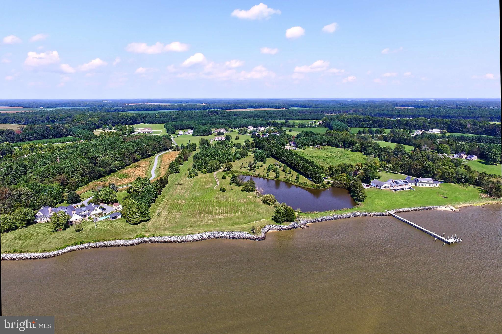 29569 Porpoise Creek Road Trappe, MD 21673 - Photo 5 of 25 a view of a street with a garden