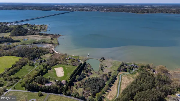 an aerial view of a house with a lake view