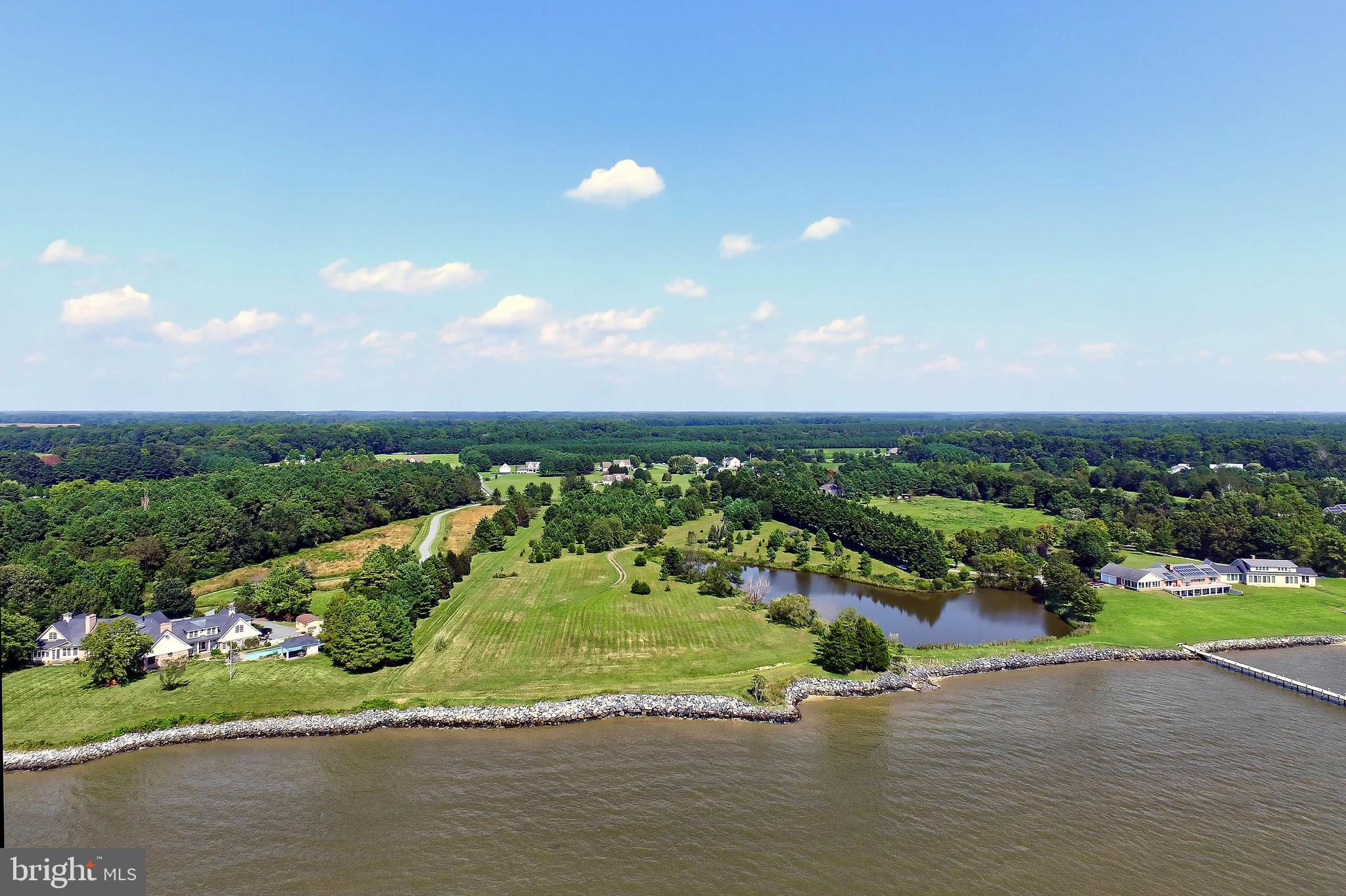 29569 Porpoise Creek Road Trappe, MD 21673 - Photo 8 of 25 an aerial view of a house with a garden and houses