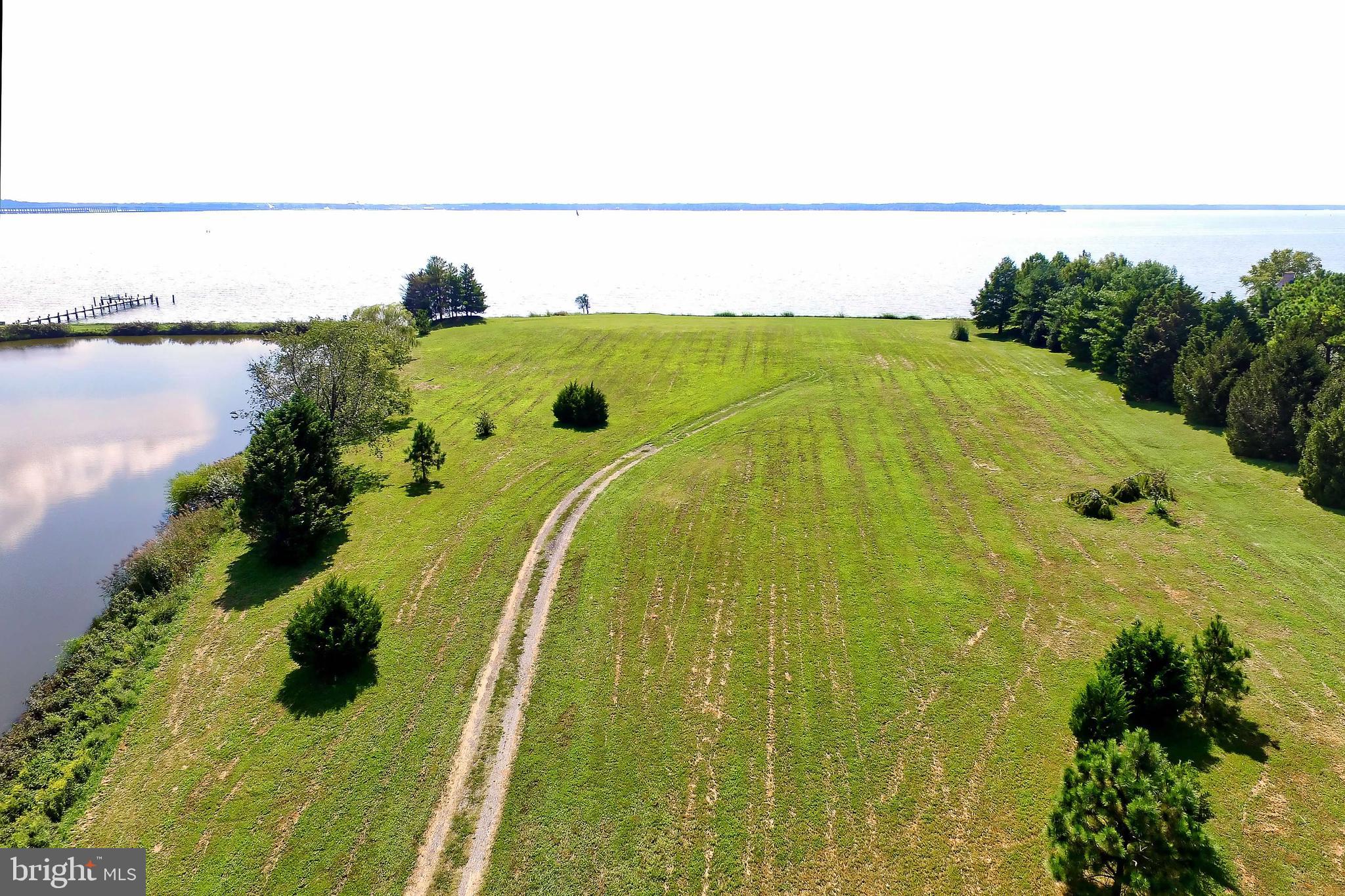 29569 Porpoise Creek Road Trappe, MD 21673 - Photo 9 of 25 a view of a swimming pool with an outdoor space