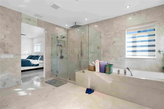 a bathroom with a sink vanity and mirror