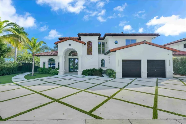 a front view of a house with yard