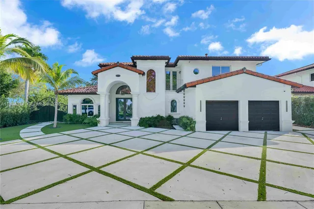 a front view of a house with yard
