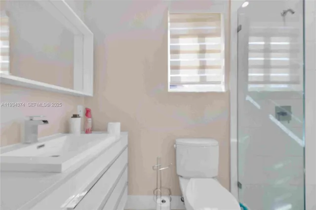 a bedroom with a bed and a ceiling fan