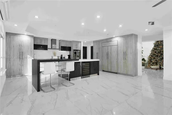 a kitchen with cabinets stainless steel appliances and sink