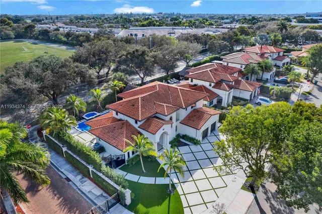 an aerial view of multiple houses with yard