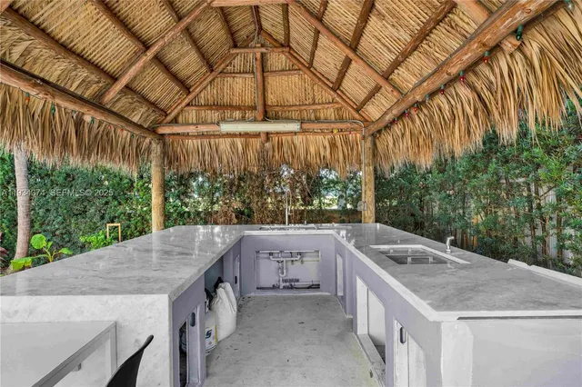 a view of a patio with swimming pool table and chairs