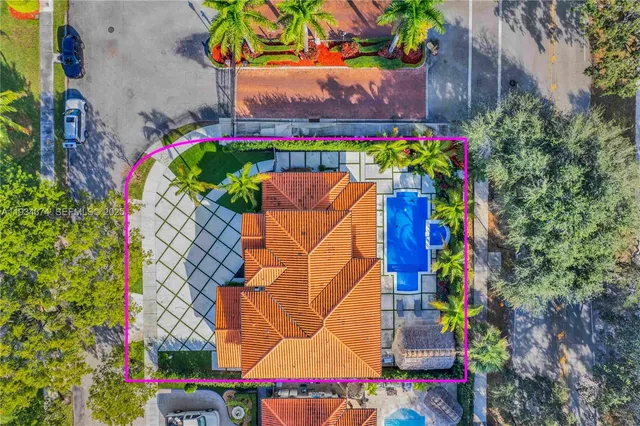 an aerial view of residential houses with outdoor space