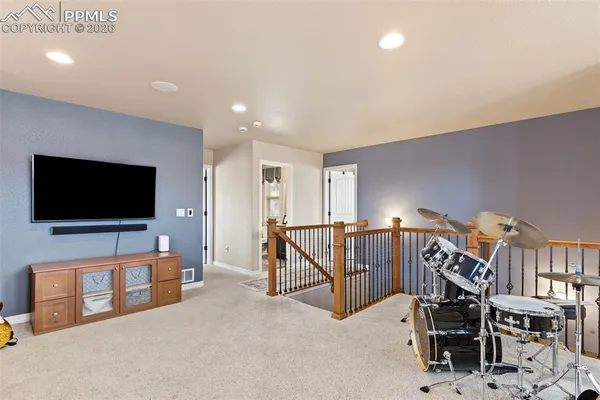 a bedroom with bed and a window