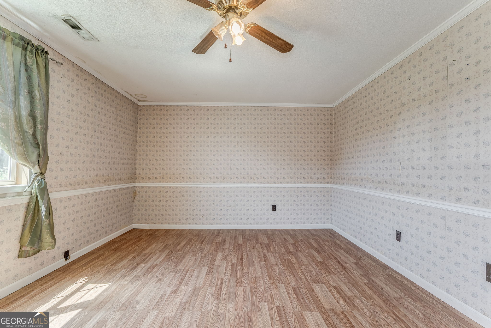 533 Underwood Street Dalton, GA 30721 - Photo 16 of 56 a view of a room with wooden floor and white walls