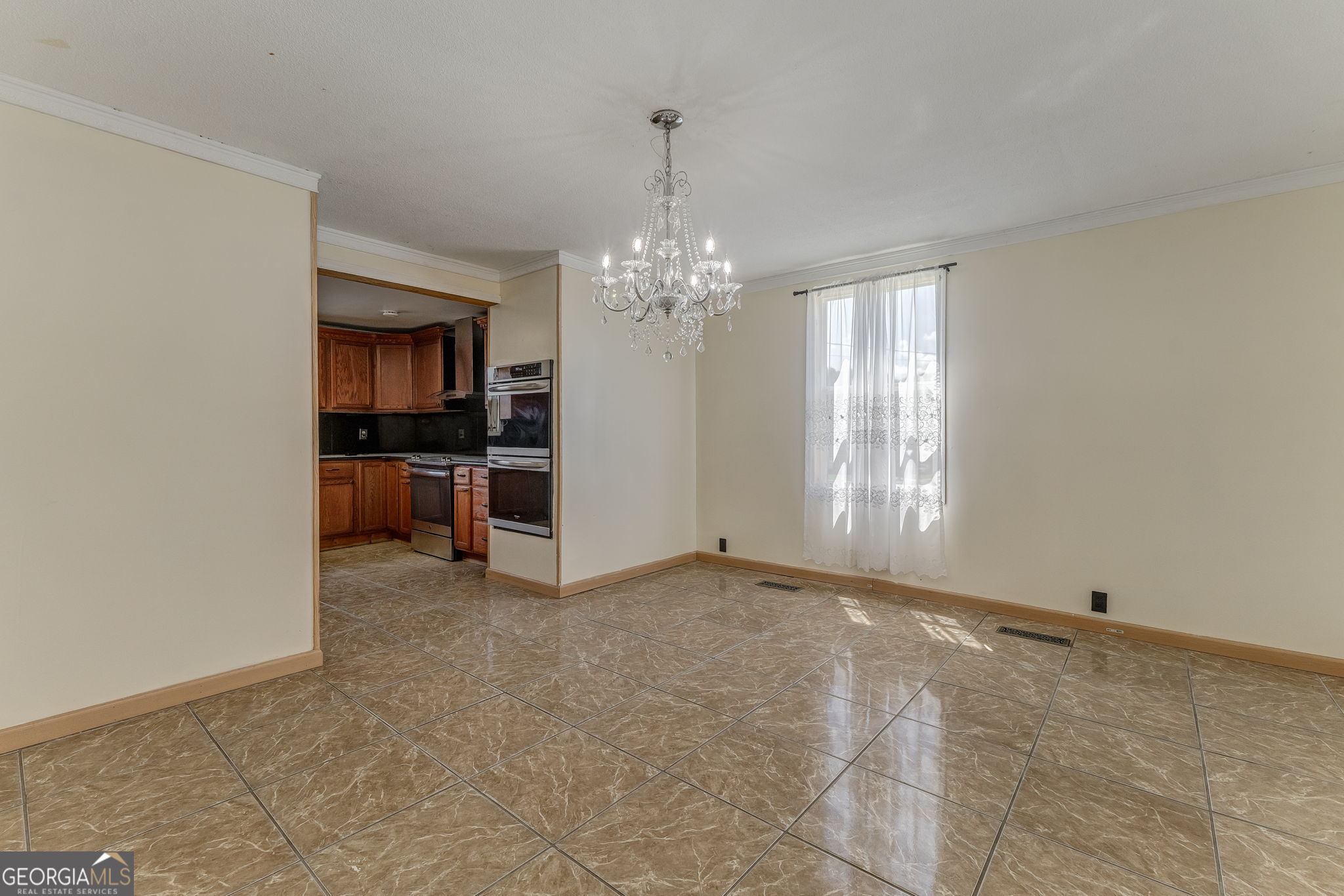 533 Underwood Street Dalton, GA 30721 - Photo 50 of 56 a view of a room with a fireplace a ceiling fan and windows