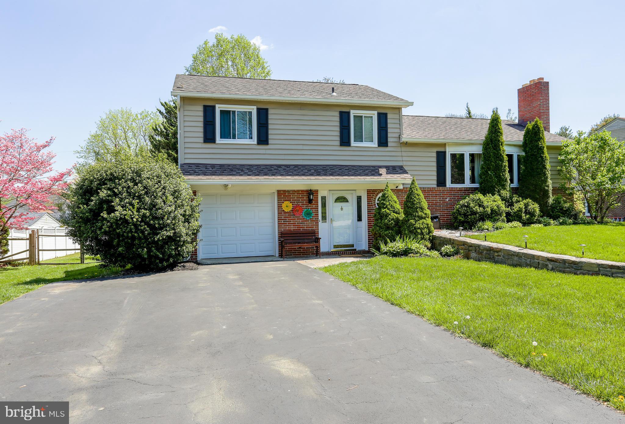 4013 High Point Road Ellicott City, MD 21042 - Photo 2 of 30 a front view of a house with garden