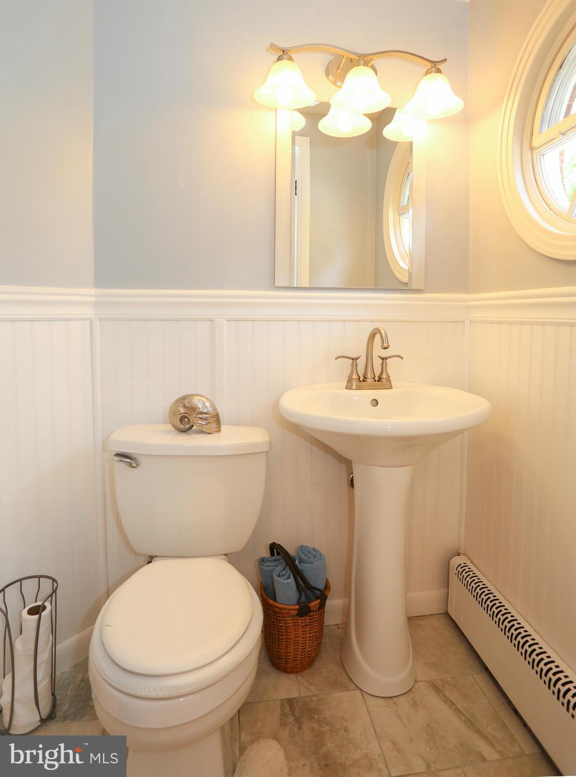 4013 High Point Road Ellicott City, MD 21042 - Photo 12 of 30 a bathroom with a sink mirror and toilet