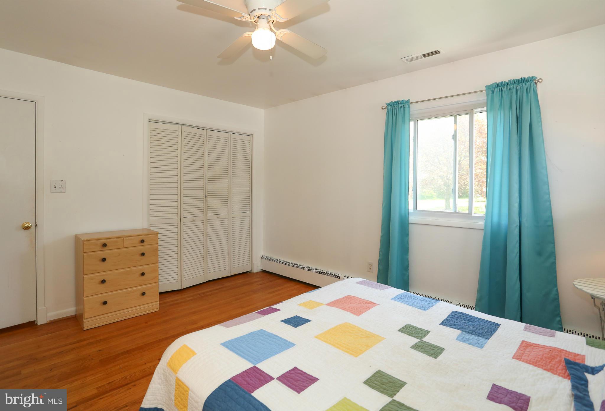4013 High Point Road Ellicott City, MD 21042 - Photo 14 of 30 a bedroom with a bed and a dresser