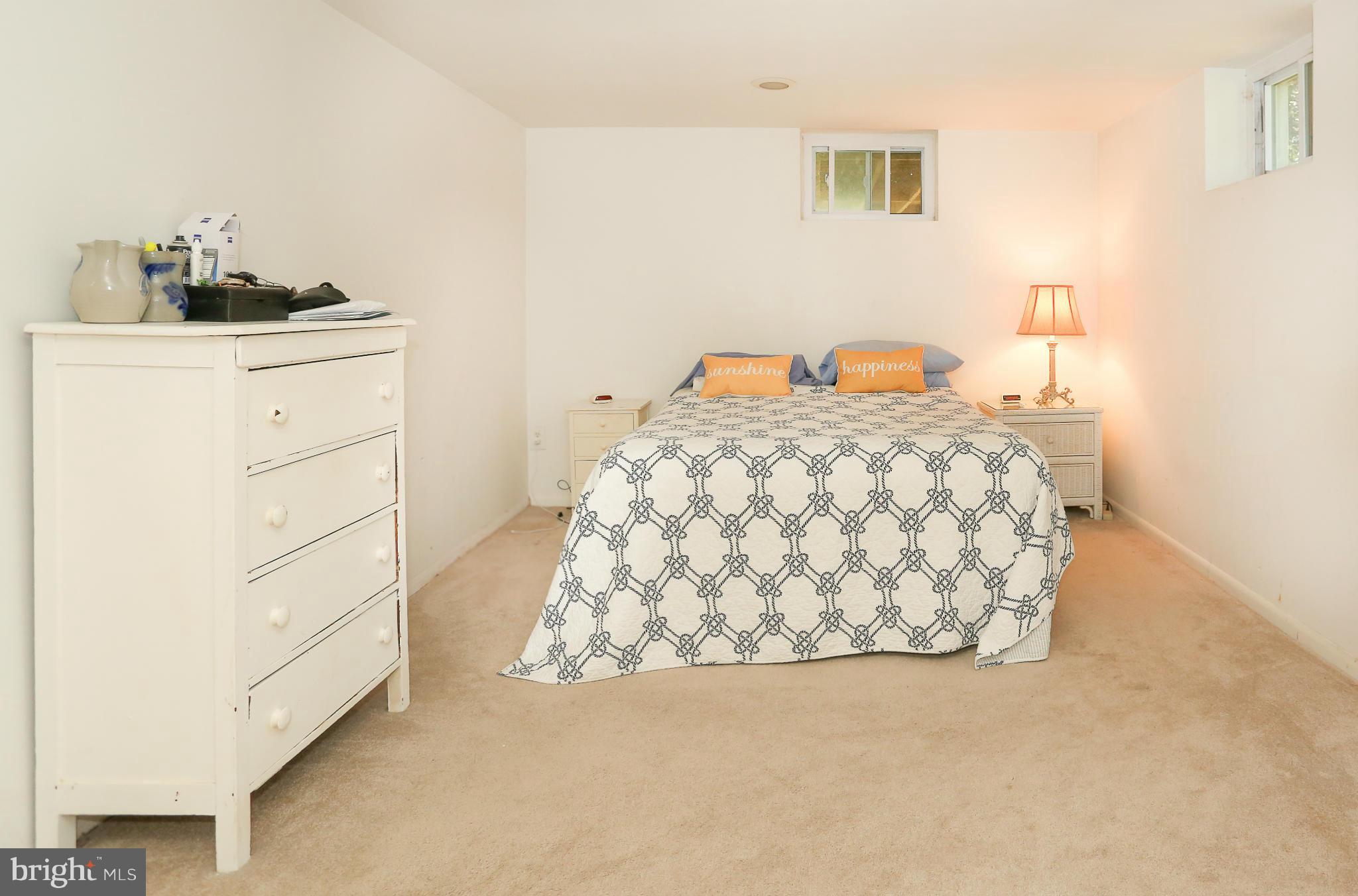 4013 High Point Road Ellicott City, MD 21042 - Photo 19 of 30 a bedroom with a bed and a cabinets
